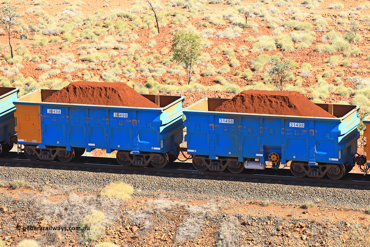 240701 2444
Western Creek, 67 km, one of Rio Tinto's blue rakes with spring assisted park brake and only electronic controlled pneumatic [ECP] braking, waggon pair 31498 is a master and is bar coupled to slave waggon 36498 built by China Northen as a Q type in 12/2022. Captured on July 1, 2024.
Keywords: 31498;36498;Q-type;China-Northern;Rio-ore-waggon;