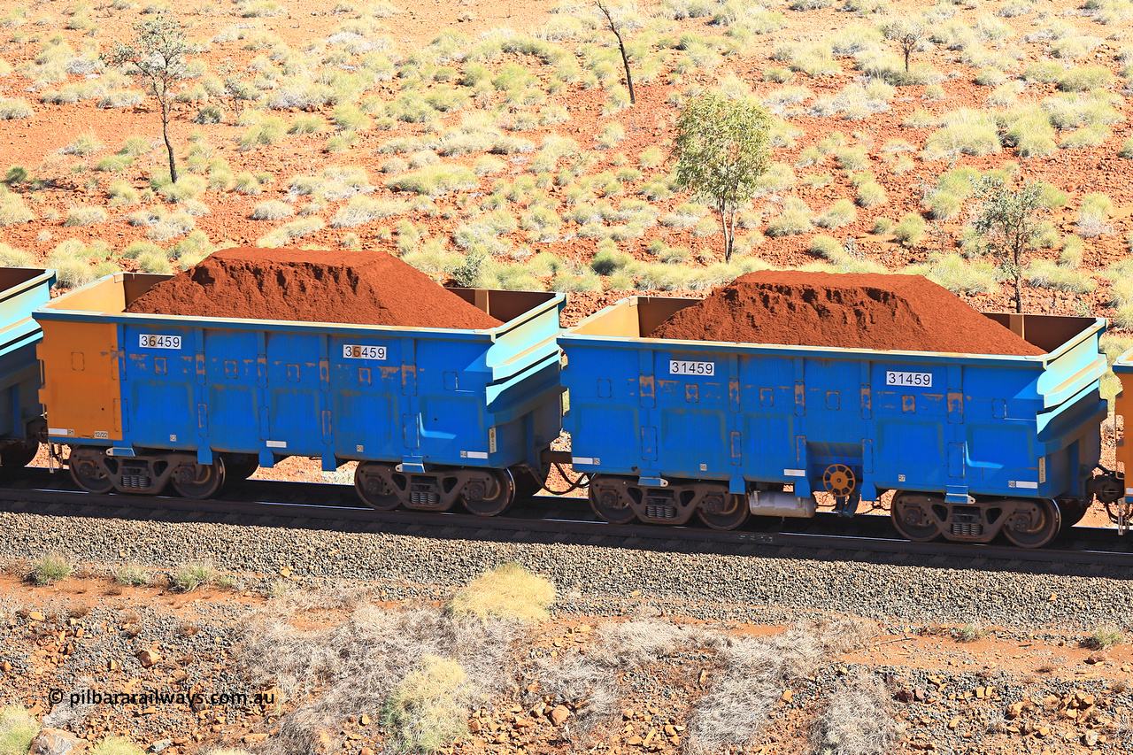 240701 2446
Western Creek, 67 km, one of Rio Tinto's blue rakes with spring assisted park brake and only electronic controlled pneumatic [ECP] braking, waggon pair 31459 is a master and is bar coupled to slave waggon 36459 built by China Northen as a Q type in 12/2022. Captured on July 1, 2024.
Keywords: 31459;36459;Q-type;China-Northern;Rio-ore-waggon;