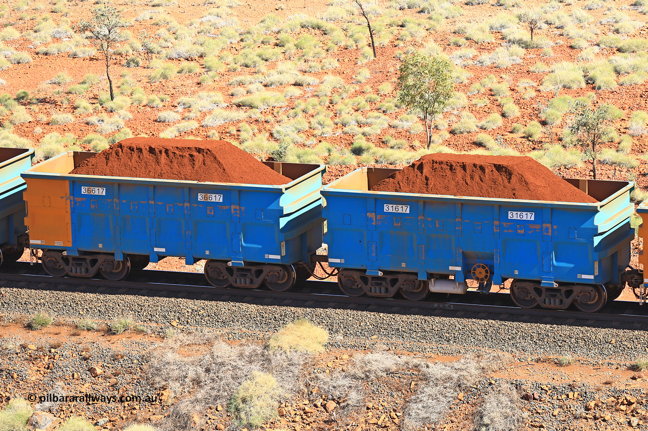 240701 2448
Western Creek, 67 km, one of Rio Tinto's blue rakes with spring assisted park brake and only electronic controlled pneumatic [ECP] braking, waggon pair 31617 is a master and is bar coupled to slave waggon 36617 built by China Northen as a Q type in 11/2022. Captured on July 1, 2024.
Keywords: 31617;36617;Q-type;China-Northern;Rio-ore-waggon;