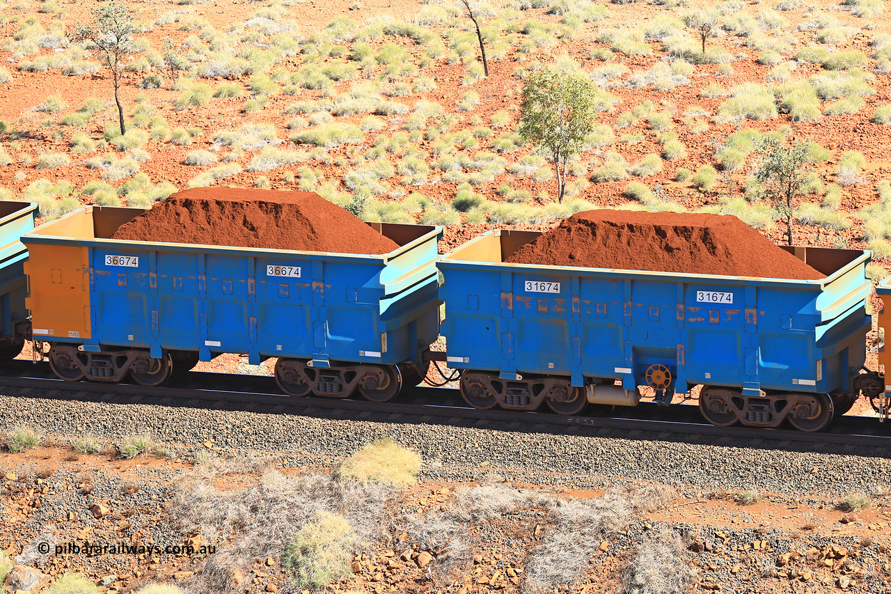 240701 2449
Western Creek, 67 km, one of Rio Tinto's blue rakes with spring assisted park brake and only electronic controlled pneumatic [ECP] braking, waggon pair 31674 is a master and is bar coupled to slave waggon 36674 built by China Northen as a Q type in 11/2022. Captured on July 1, 2024.
Keywords: 31674;36674;Q-type;China-Northern;Rio-ore-waggon;