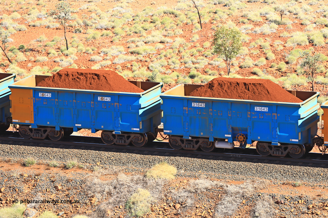 240701 2451
Western Creek, 67 km, one of Rio Tinto's blue rakes with spring assisted park brake and only electronic controlled pneumatic [ECP] braking, waggon pair 31643 is a master and is bar coupled to slave waggon 36643 built by China Northen as a Q type in 11/2022. Captured on July 1, 2024.
Keywords: 31643;36643;Q-type;China-Northern;Rio-ore-waggon;