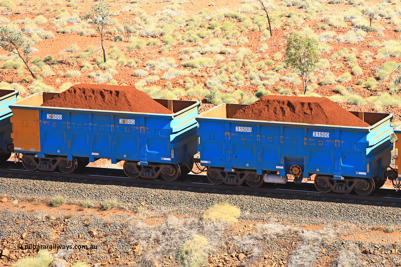 240701 2452
Western Creek, 67 km, one of Rio Tinto's blue rakes with spring assisted park brake and only electronic controlled pneumatic [ECP] braking, waggon pair 31500 is a master and is bar coupled to slave waggon 36500 built by China Northen as a Q type in 12/2022. Captured on July 1, 2024.
Keywords: 31500;36500;Q-type;China-Northern;Rio-ore-waggon;