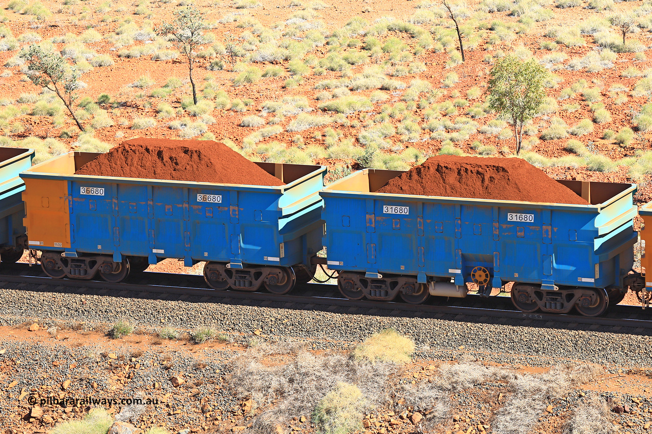 240701 2459
Western Creek, 67 km, one of Rio Tinto's blue rakes with spring assisted park brake and only electronic controlled pneumatic [ECP] braking, waggon pair 31680 is a master and is bar coupled to slave waggon 36680 built by China Northen as a Q type in 11/2022. Captured on July 1, 2024.
Keywords: 31680;36680;Q-type;China-Northern;Rio-ore-waggon;