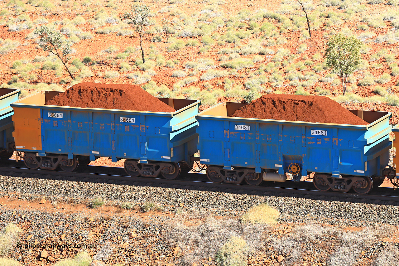 240701 2460
Western Creek, 67 km, one of Rio Tinto's blue rakes with spring assisted park brake and only electronic controlled pneumatic [ECP] braking, waggon pair 31681 is a master and is bar coupled to slave waggon 36681 built by China Northen as a Q type in 11/2022. Captured on July 1, 2024.
Keywords: 31681;36681;Q-type;China-Northern;Rio-ore-waggon;