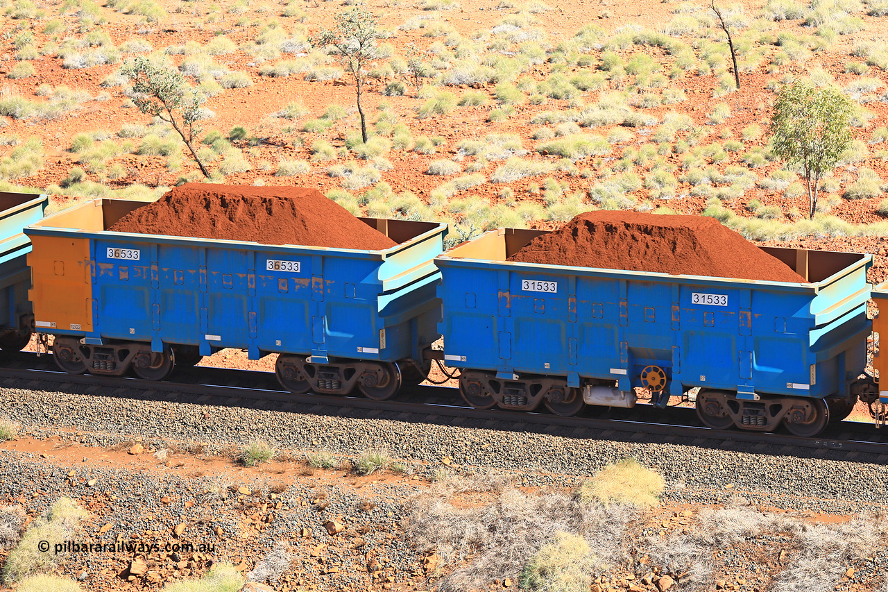 240701 2468
Western Creek, 67 km, one of Rio Tinto's blue rakes with spring assisted park brake and only electronic controlled pneumatic [ECP] braking, waggon pair 31533 is a master and is bar coupled to slave waggon 36533 built by China Northen as a Q type in 12/2022. Captured on July 1, 2024.
Keywords: 31533;36533;Q-type;China-Northern;Rio-ore-waggon;