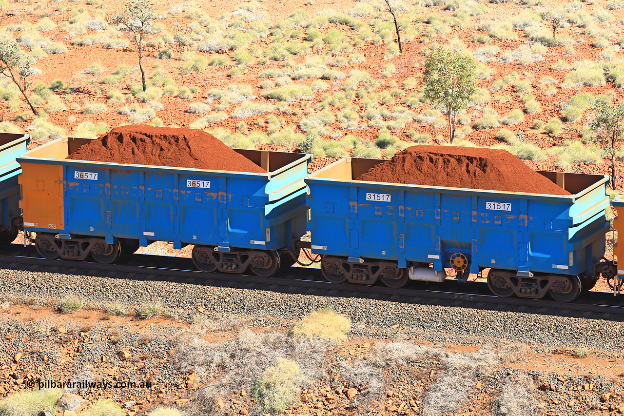 240701 2470
Western Creek, 67 km, one of Rio Tinto's blue rakes with spring assisted park brake and only electronic controlled pneumatic [ECP] braking, waggon pair 31517 is a master and is bar coupled to slave waggon 36517 built by China Northen as a Q type in 12/2022. Captured on July 1, 2024.
Keywords: 31517;36517;Q-type;China-Northern;Rio-ore-waggon;