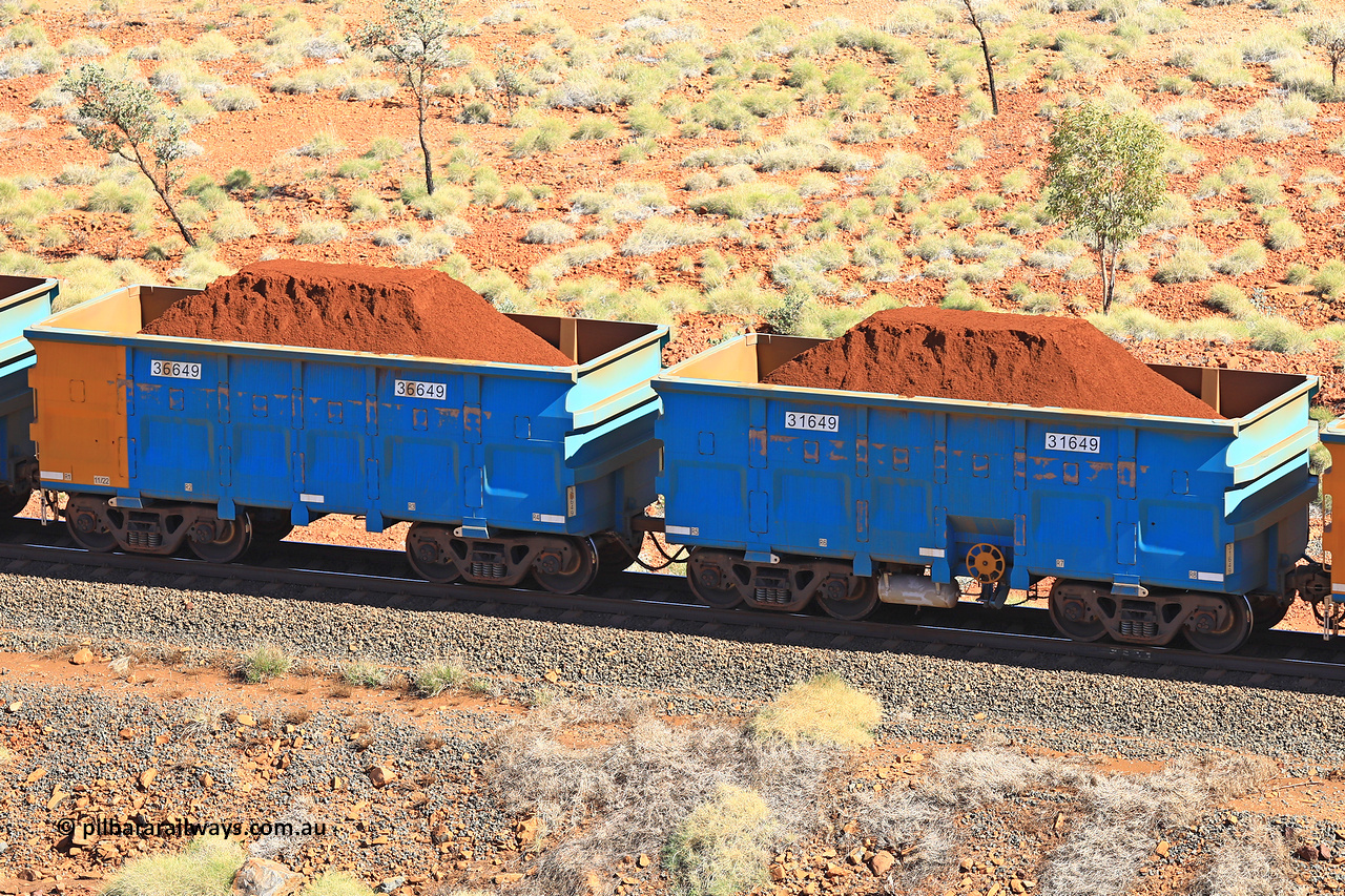 240701 2472
Western Creek, 67 km, one of Rio Tinto's blue rakes with spring assisted park brake and only electronic controlled pneumatic [ECP] braking, waggon pair 31649 is a master and is bar coupled to slave waggon 36649 built by China Northen as a Q type in 11/2022. Captured on July 1, 2024.
Keywords: 31649;36649;Q-type;China-Northern;Rio-ore-waggon;