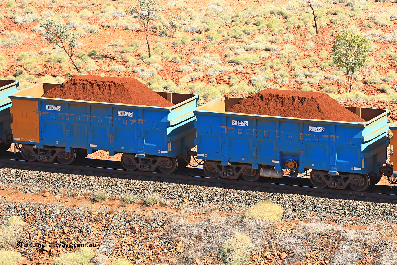 240701 2477
Western Creek, 67 km, one of Rio Tinto's blue rakes with spring assisted park brake and only electronic controlled pneumatic [ECP] braking, waggon pair 31572 is a master and is bar coupled to slave waggon 36572 built by China Northen as a Q type in 12/2022. Captured on July 1, 2024.
Keywords: 31572;36572;Q-type;China-Northern;Rio-ore-waggon;