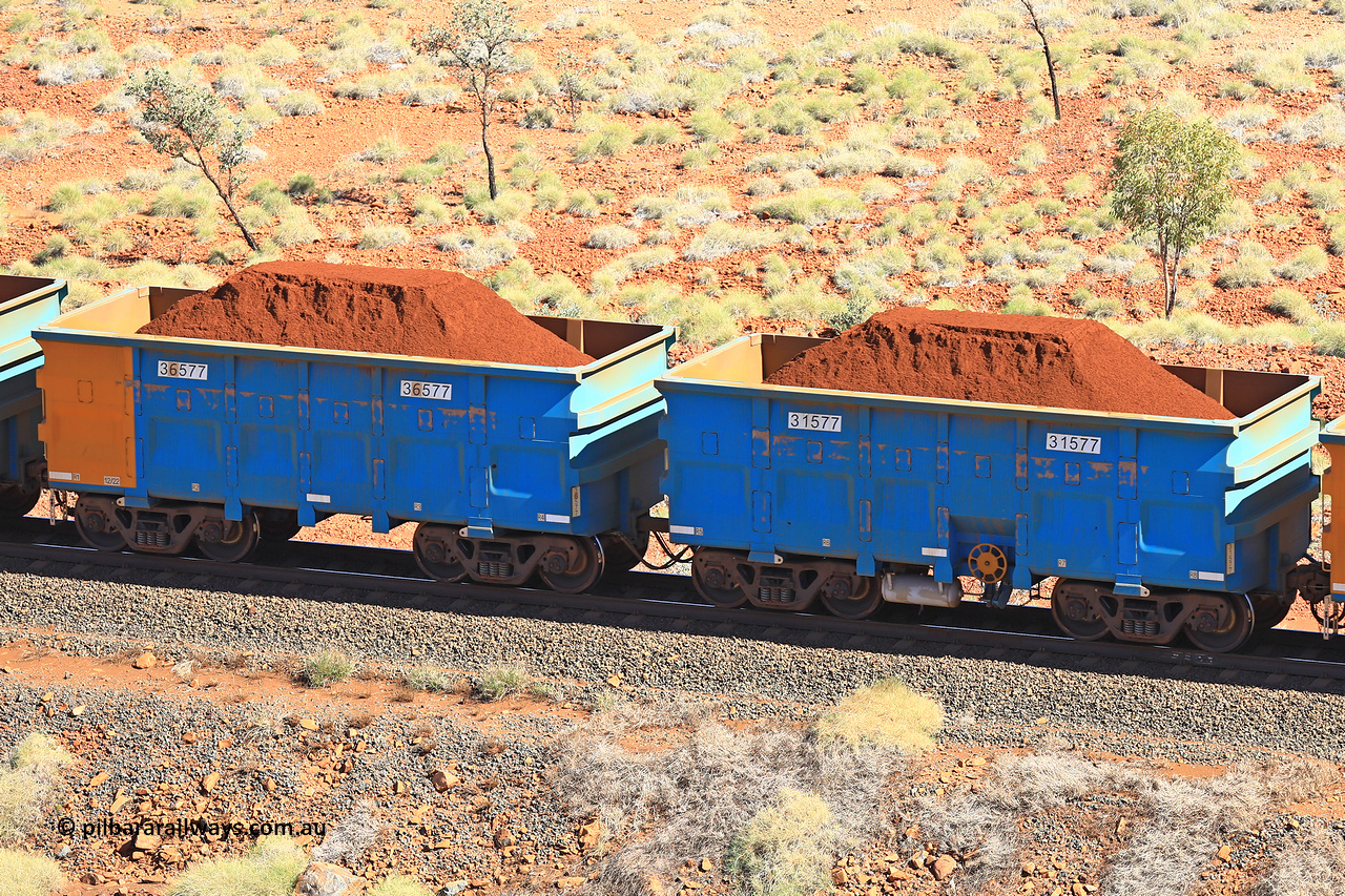 240701 2479
Western Creek, 67 km, one of Rio Tinto's blue rakes with spring assisted park brake and only electronic controlled pneumatic [ECP] braking, waggon pair 31577 is a master and is bar coupled to slave waggon 36577 built by China Northen as a Q type in 12/2022. Captured on July 1, 2024.
Keywords: 31577;36577;Q-type;China-Northern;Rio-ore-waggon;