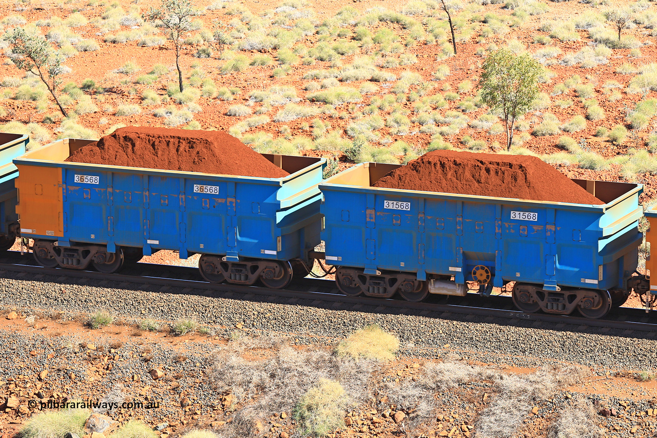 240701 2480
Western Creek, 67 km, one of Rio Tinto's blue rakes with spring assisted park brake and only electronic controlled pneumatic [ECP] braking, waggon pair 31568 is a master and is bar coupled to slave waggon 36568 built by China Northen as a Q type in 12/2022. Captured on July 1, 2024.
Keywords: 31568;36568;Q-type;China-Northern;Rio-ore-waggon;