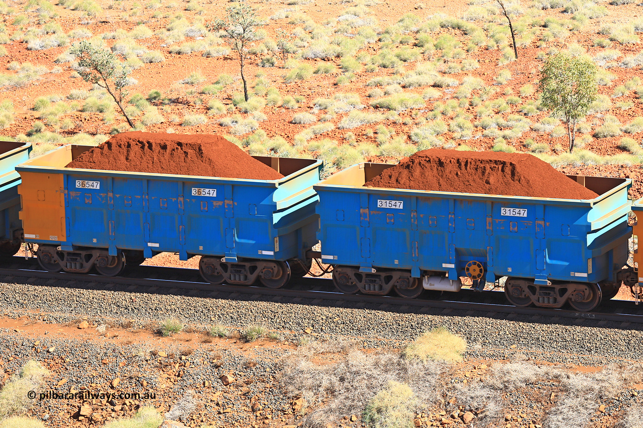 240701 2483
Western Creek, 67 km, one of Rio Tinto's blue rakes with spring assisted park brake and only electronic controlled pneumatic [ECP] braking, waggon pair 31547 is a master and is bar coupled to slave waggon 36547 built by China Northen as a Q type in 12/2022. Captured on July 1, 2024.
Keywords: 31547;36547;Q-type;China-Northern;Rio-ore-waggon;