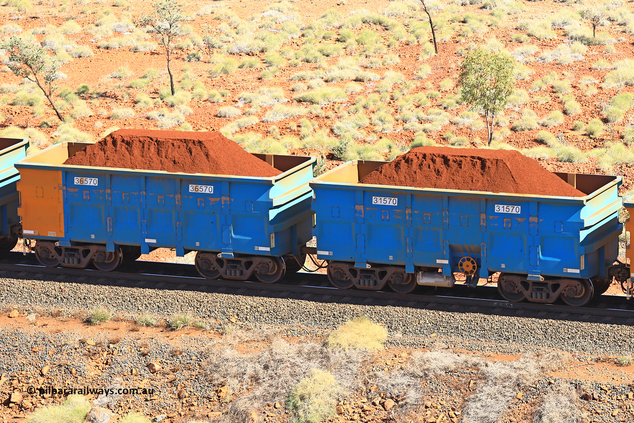 240701 2484
Western Creek, 67 km, one of Rio Tinto's blue rakes with spring assisted park brake and only electronic controlled pneumatic [ECP] braking, waggon pair 31570 is a master and is bar coupled to slave waggon 36570 built by China Northen as a Q type in 12/2022. Captured on July 1, 2024.
Keywords: 31570;36570;Q-type;China-Northern;Rio-ore-waggon;