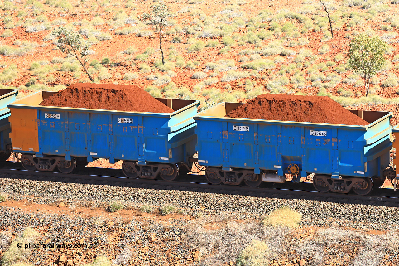 240701 2485
Western Creek, 67 km, one of Rio Tinto's blue rakes with spring assisted park brake and only electronic controlled pneumatic [ECP] braking, waggon pair 31558 is a master and is bar coupled to slave waggon 36558 built by China Northen as a Q type in 12/2022. Captured on July 1, 2024.
Keywords: 31558;36558;Q-type;China-Northern;Rio-ore-waggon;