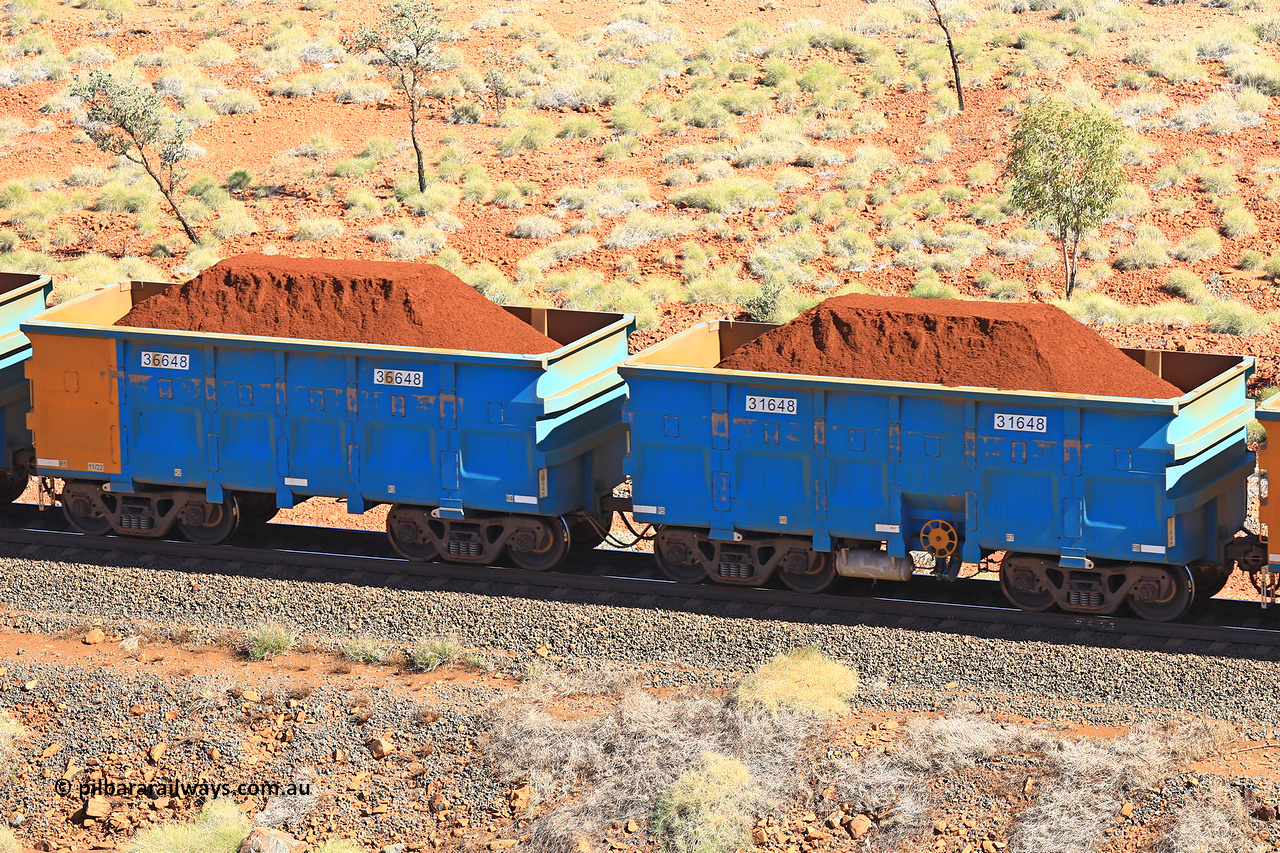 240701 2487
Western Creek, 67 km, one of Rio Tinto's blue rakes with spring assisted park brake and only electronic controlled pneumatic [ECP] braking, waggon pair 31648 is a master and is bar coupled to slave waggon 36648 built by China Northen as a Q type in 11/2022. Captured on July 1, 2024.
Keywords: 31648;36648;Q-type;China-Northern;Rio-ore-waggon;