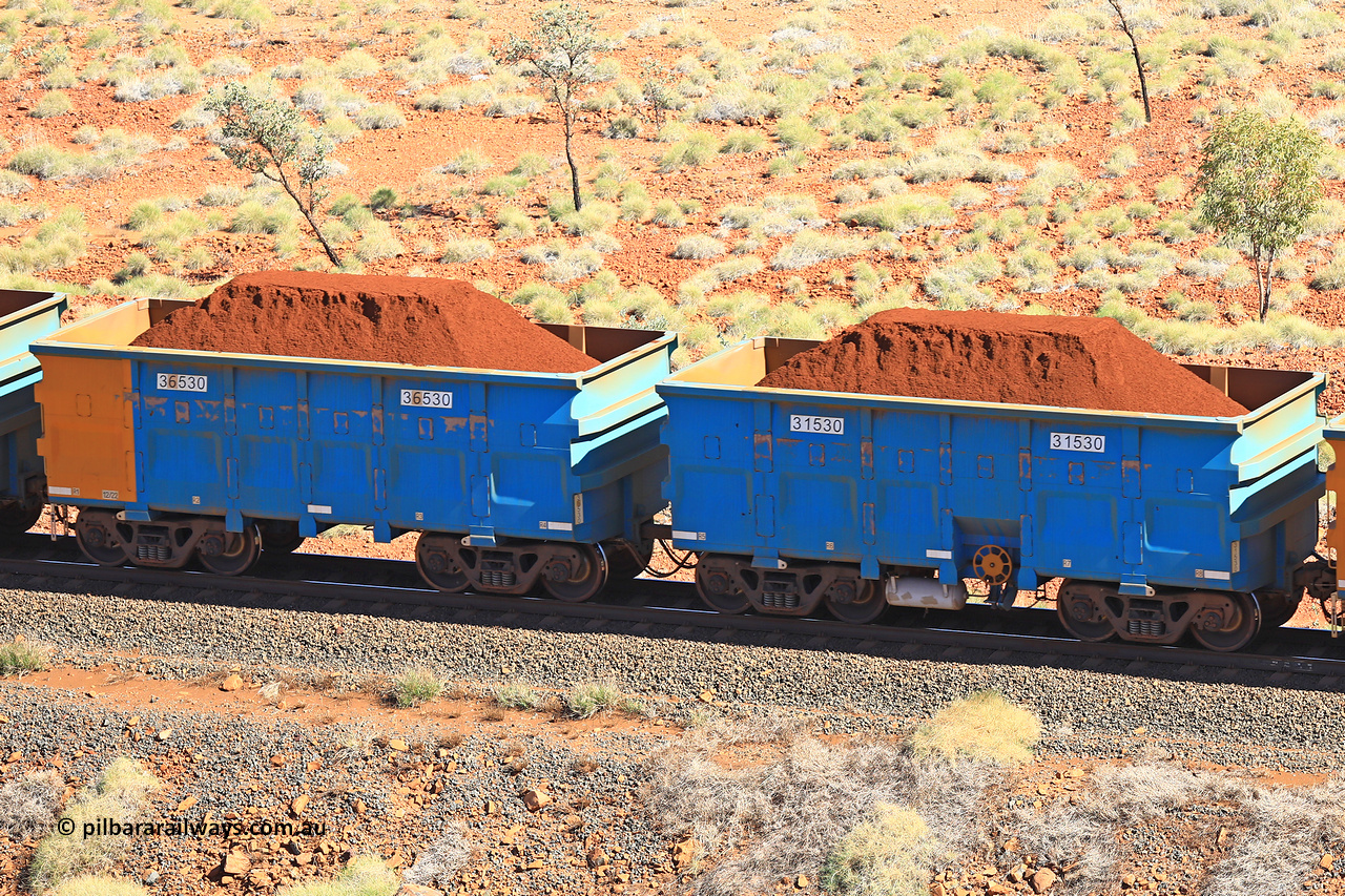240701 2488
Western Creek, 67 km, one of Rio Tinto's blue rakes with spring assisted park brake and only electronic controlled pneumatic [ECP] braking, waggon pair 31530 is a master and is bar coupled to slave waggon 36530 built by China Northen as a Q type in 12/2022. Captured on July 1, 2024.
Keywords: 31530;36530;Q-type;China-Northern;Rio-ore-waggon;