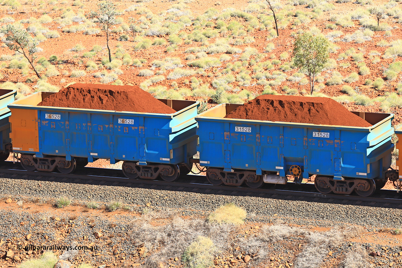 240701 2490
Western Creek, 67 km, one of Rio Tinto's blue rakes with spring assisted park brake and only electronic controlled pneumatic [ECP] braking, waggon pair 31528 is a master and is bar coupled to slave waggon 36528 built by China Northen as a Q type in 12/2022. Captured on July 1, 2024.
Keywords: 31528;36528;Q-type;China-Northern;Rio-ore-waggon;