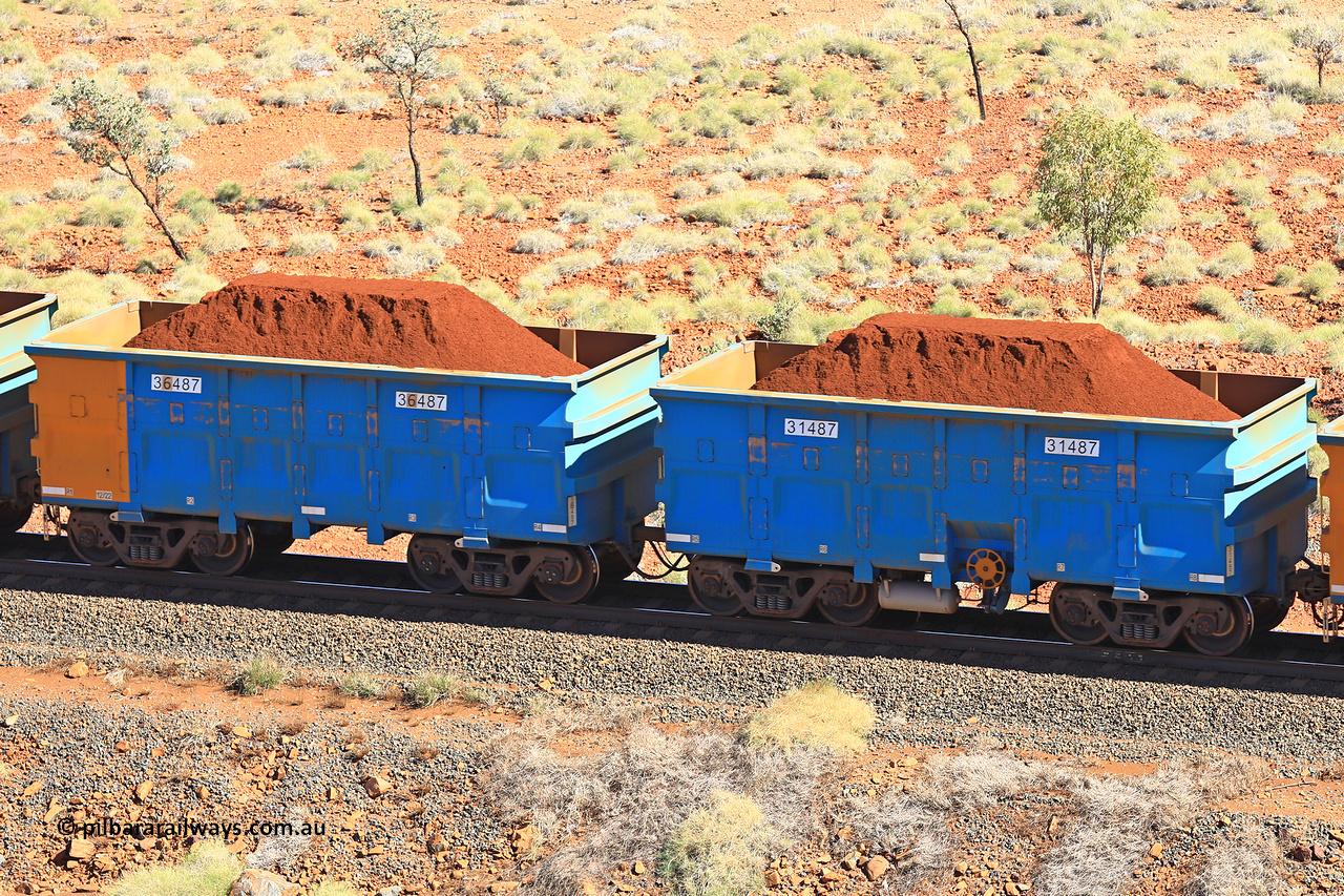 240701 2496
Western Creek, 67 km, one of Rio Tinto's blue rakes with spring assisted park brake and only electronic controlled pneumatic [ECP] braking, waggon pair 31487 is a master and is bar coupled to slave waggon 36487 built by China Northen as a Q type in 12/2022. Captured on July 1, 2024.
Keywords: 31487;36487;Q-type;China-Northern;Rio-ore-waggon;