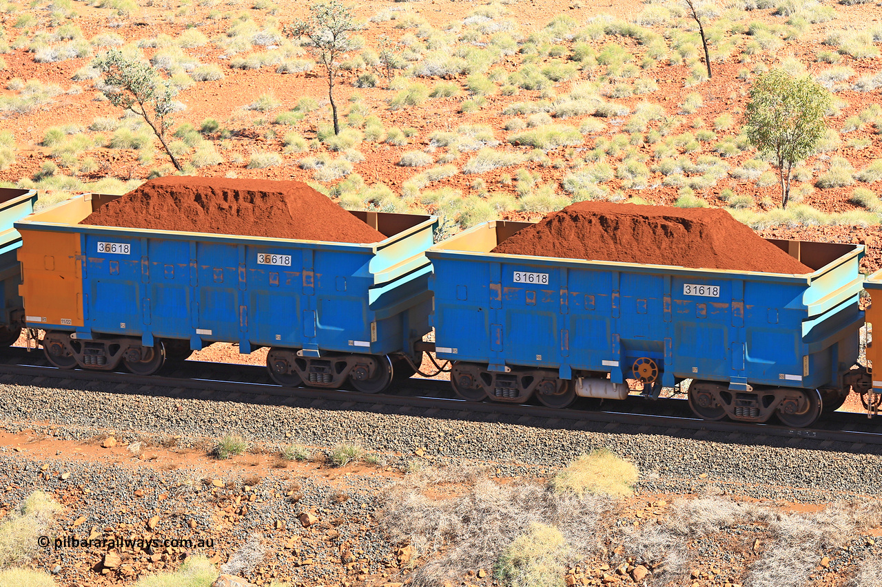 240701 2498
Western Creek, 67 km, one of Rio Tinto's blue rakes with spring assisted park brake and only electronic controlled pneumatic [ECP] braking, waggon pair 31618 is a master and is bar coupled to slave waggon 36618 built by China Northen as a Q type in 11/2022. Captured on July 1, 2024.
Keywords: 31618;36618;Q-type;China-Northern;Rio-ore-waggon;