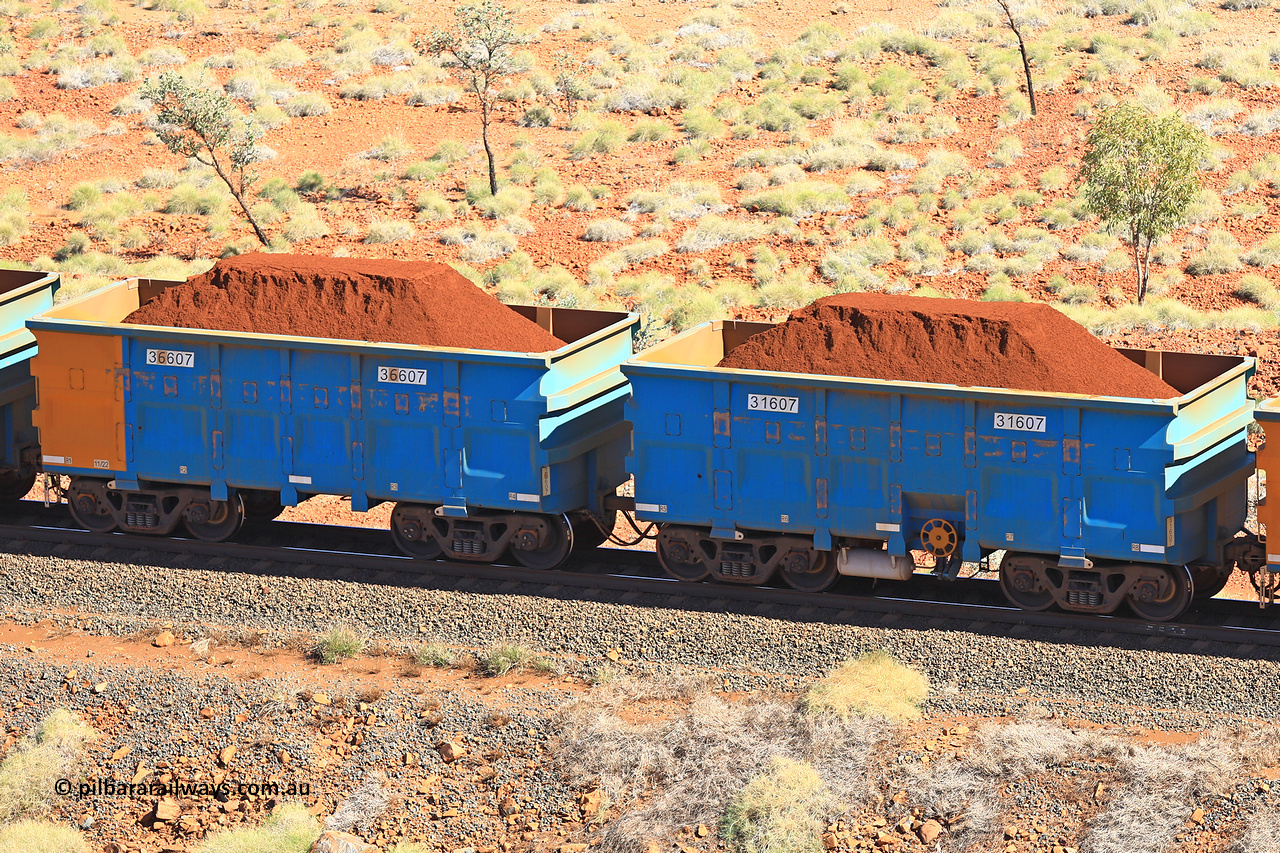 240701 2499
Western Creek, 67 km, one of Rio Tinto's blue rakes with spring assisted park brake and only electronic controlled pneumatic [ECP] braking, waggon pair 31607 is a master and is bar coupled to slave waggon 36607 built by China Northen as a Q type in 11/2022. Captured on July 1, 2024.
Keywords: 31607;36607;Q-type;China-Northern;Rio-ore-waggon;