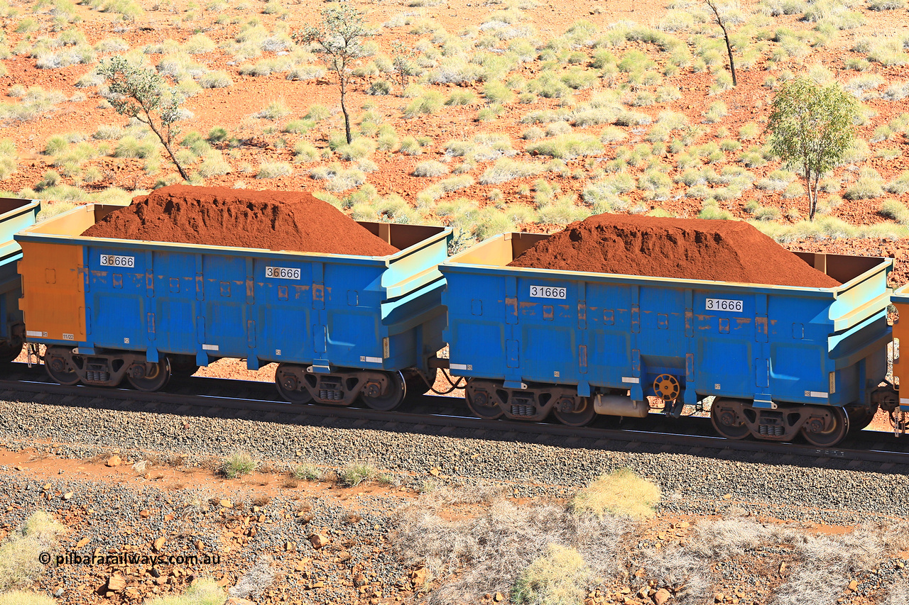 240701 2500
Western Creek, 67 km, one of Rio Tinto's blue rakes with spring assisted park brake and only electronic controlled pneumatic [ECP] braking, waggon pair 31666 is a master and is bar coupled to slave waggon 36666 built by China Northen as a Q type in 11/2022. Captured on July 1, 2024.
Keywords: 31666;36666;Q-type;China-Northern;Rio-ore-waggon;