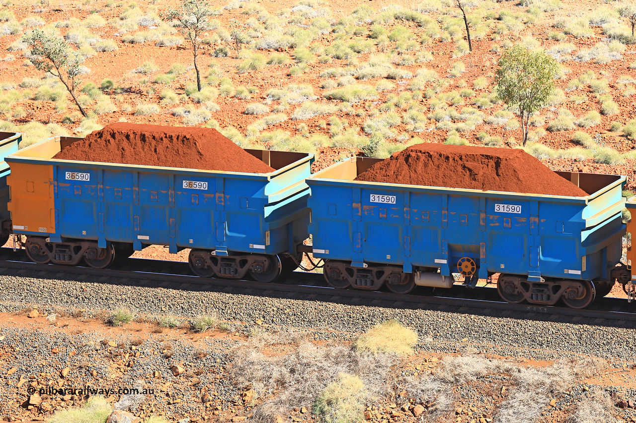 240701 2501
Western Creek, 67 km, one of Rio Tinto's blue rakes with spring assisted park brake and only electronic controlled pneumatic [ECP] braking, waggon pair 31590 is a master and is bar coupled to slave waggon 36590 built by China Northen as a Q type in 11/2022. Captured on July 1, 2024.
Keywords: 31590;36590;Q-type;China-Northern;Rio-ore-waggon;