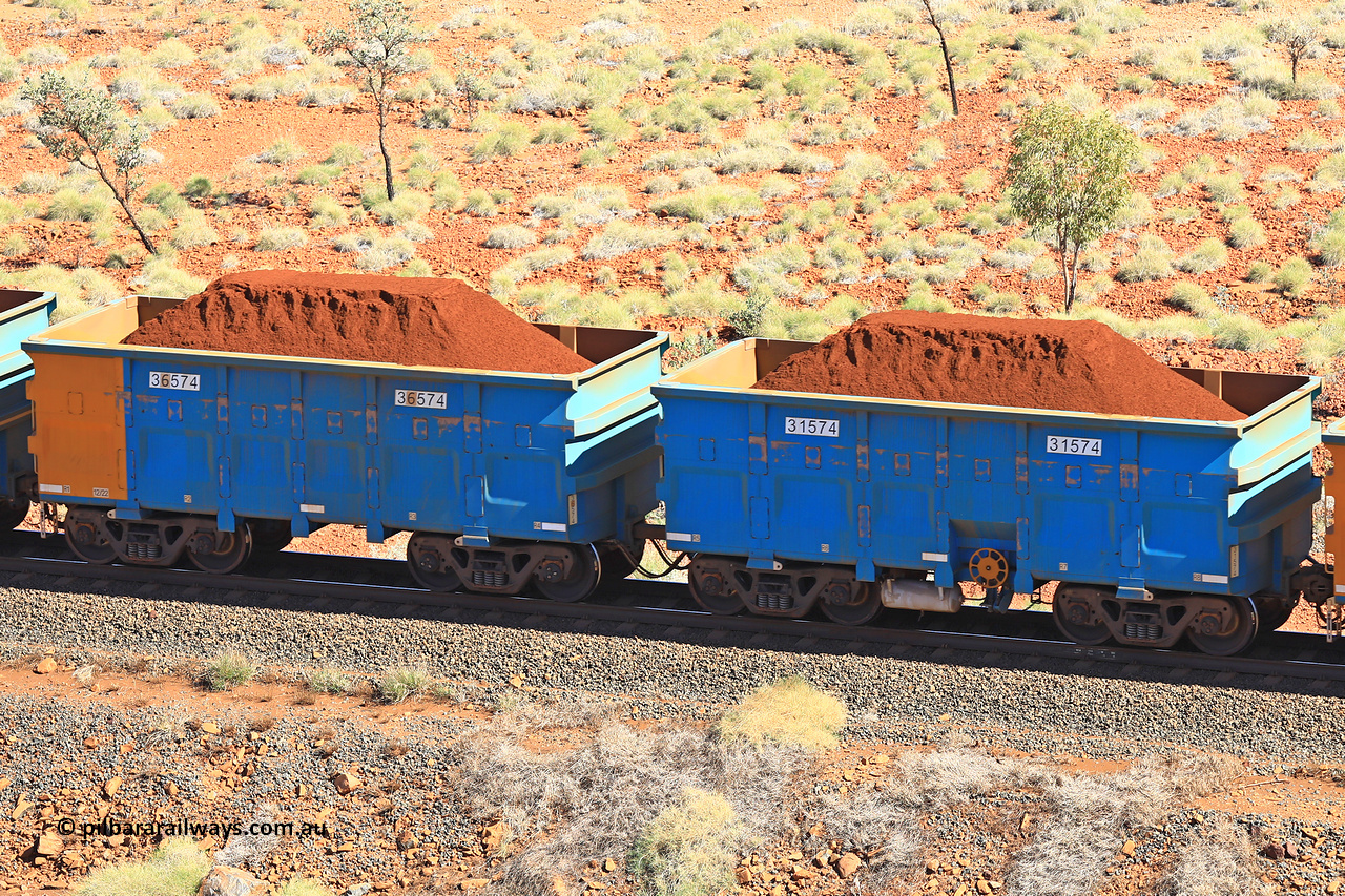 240701 2502
Western Creek, 67 km, one of Rio Tinto's blue rakes with spring assisted park brake and only electronic controlled pneumatic [ECP] braking, waggon pair 31574 is a master and is bar coupled to slave waggon 36574 built by China Northen as a Q type in 11/2022. Captured on July 1, 2024.
Keywords: 31574;36574;Q-type;China-Northern;Rio-ore-waggon;