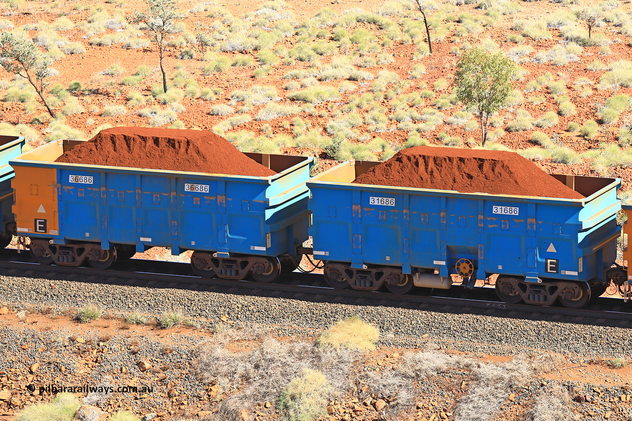 240701 2503
Western Creek, 67 km, one of Rio Tinto's blue rakes with spring assisted park brake and only electronic controlled pneumatic [ECP] braking, waggon pair 31686 is a master and is bar coupled to slave waggon 36686 built by China Northen as a Q type in 11/2022. Captured on July 1, 2024.
Keywords: 31686;36686;Q-type;China-Northern;Rio-ore-waggon;