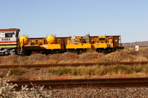 060723 7828
Rio Tinto compressor waggon set CB 02, compressor control waggon with two diesel powered Atlas Copco XAS 97's and the receiver waggon with two air tanks or receivers. Note the waggons are cut down ore waggons. Seen here inside 7 Mile. 23rd July 2006.
Keywords: CB02;rio-compressor-waggon;