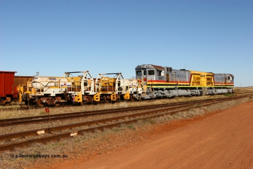 060723 7846
Original Hamersley Iron compressor waggon sets IC-1 and IC-3 which were made from cutting down condemned ore waggons and then fitting Atlas Copco XAS 97 air compressors, receiver tanks and fuel tanks. The compressors have been fitted to a swing cradle to limit the in-train forces during the unloading process. 7 Mile 23rd July 2006.
Keywords: IC-1;IC-3;rio-compressor-waggon;