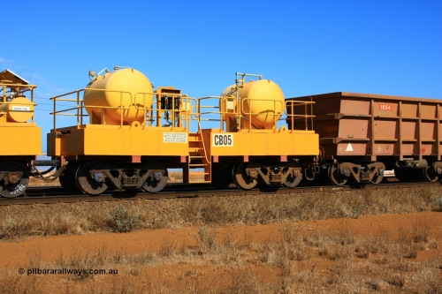 100330 8067
Rio Tinto compressor waggon set CB 05, receiver waggon with two air tanks or receivers. Note the waggons are cut down ore waggons and the wheels are marked 70 kph max. Seen here just outside of 7 Mile. 30th March 2010.
Keywords: CB05;rio-compressor-waggon;
