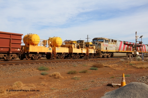 141124 7092
Rio Tinto compressor waggon set leader CB 01, compressor control waggon with two diesel powered Atlas Copco XAS 97's behind the loco and the receiver waggon with two air tanks or receivers. Note the waggons are cut down ore waggons. Seen here at 7 Mile, Dampier on 24th November 2014.
Keywords: CB01;rio-compressor-waggon;