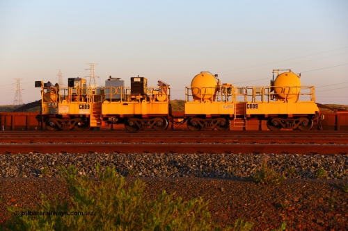 170510 8282
Rio Tinto compressor waggon set CB 09, compressor control waggon with two diesel powered Kaeser M57 Utility air compressors and the receiver waggon with two air tanks or receivers. Note the waggons are modified ore waggon frames. Seen here at Cape Lambert. 10th May 2017.
Keywords: CB09;rio-compressor-waggon;