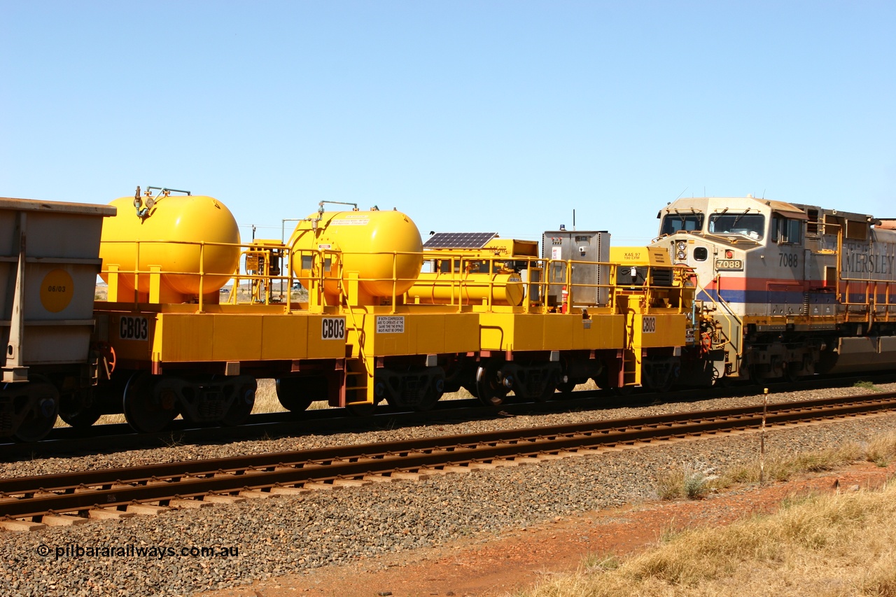 060715 6949
Rio Tinto compressor waggon set CB 03, compressor control waggon with two diesel powered Atlas Copco XAS 97's behind the loco and the receiver waggon with two air tanks or receivers closet to camera. Note the waggons are cut down ore waggons. Seen here just outside of 7 Mile. 15th July 2006.
Keywords: CB03;rio-compressor-waggon;