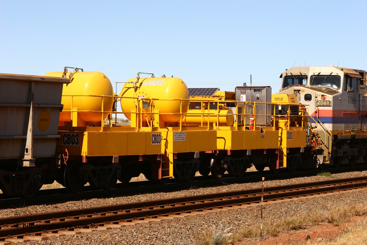060715 6950
Rio Tinto compressor waggon set CB 03, compressor control waggon with two diesel powered Atlas Copco XAS 97's behind the loco and the receiver waggon with two air tanks or receivers closet to camera. Note the waggons are cut down ore waggons. Seen here just outside of 7 Mile. 15th July 2006.
Keywords: CB03;rio-compressor-waggon;