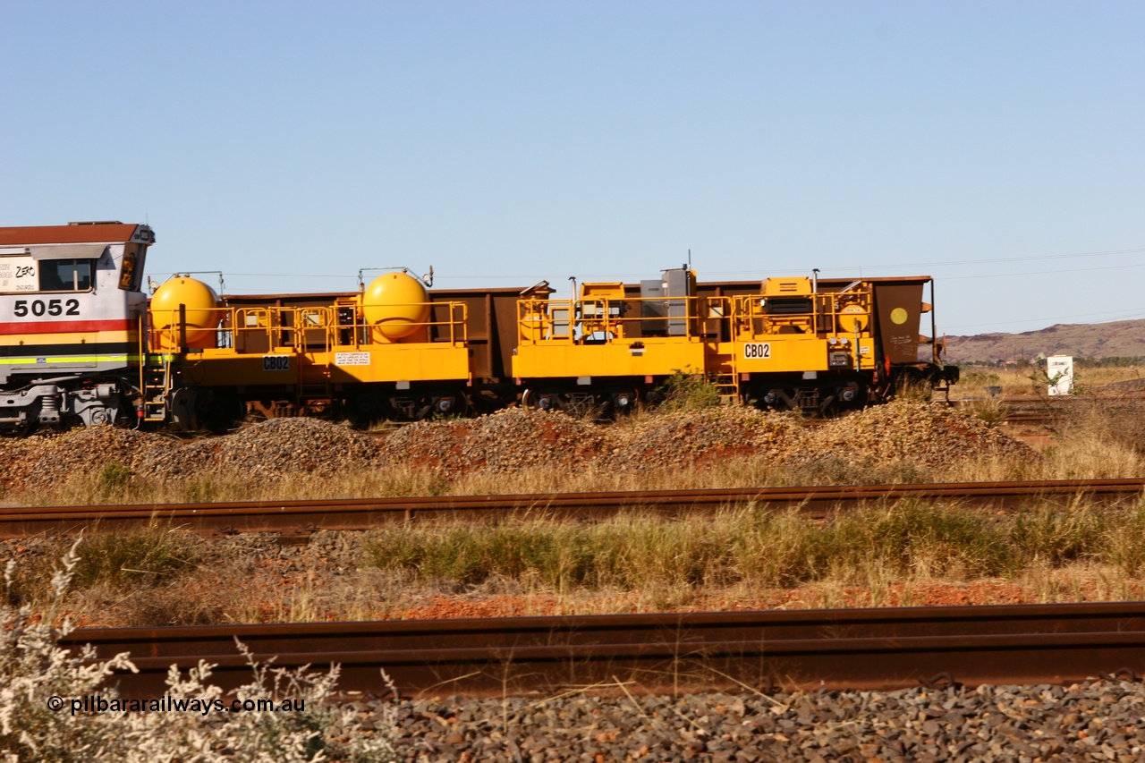 060723 7828
Rio Tinto compressor waggon set CB 02, compressor control waggon with two diesel powered Atlas Copco XAS 97's and the receiver waggon with two air tanks or receivers. Note the waggons are cut down ore waggons. Seen here inside 7 Mile. 23rd July 2006.
Keywords: CB02;rio-compressor-waggon;
