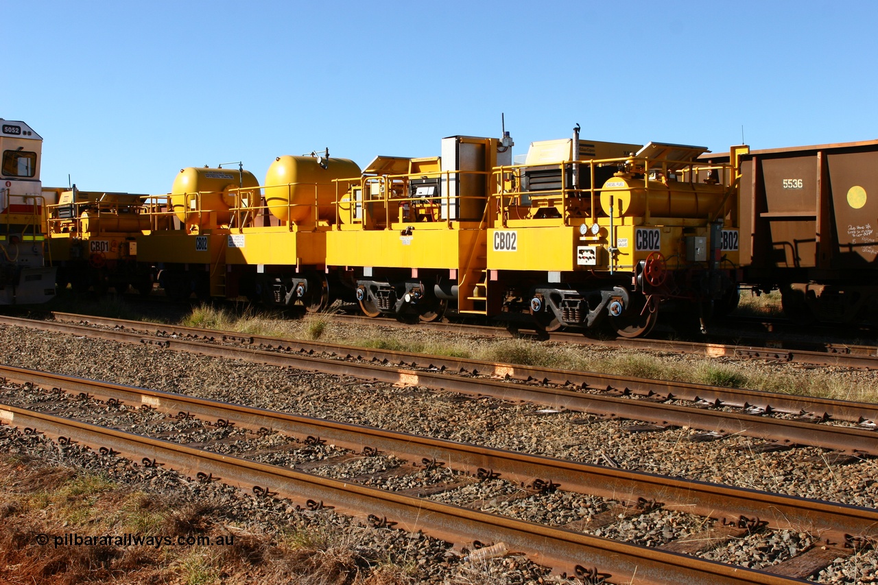 060723 7834
Rio Tinto compressor waggon set CB 02, compressor control waggon with two diesel powered Atlas Copco XAS 97's and the receiver waggon with two air tanks or receivers. Note the waggons are cut down ore waggons. Seen here inside 7 Mile. 23rd July 2006.
Keywords: CB02;rio-compressor-waggon;