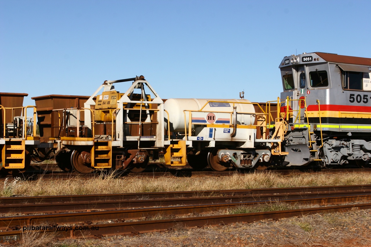 060723 7844
Original Hamersley Iron compressor waggon set IC-3 which were made from cutting down condemned ore waggons and then fitting Atlas Copco XAS 97 air compressors, receiver tanks and fuel tanks. The compressors have been fitted to a swing cradle to limit the in-train forces during the unloading process. 7 Mile 23rd July 2006.
Keywords: IC-3;rio-compressor-waggon;