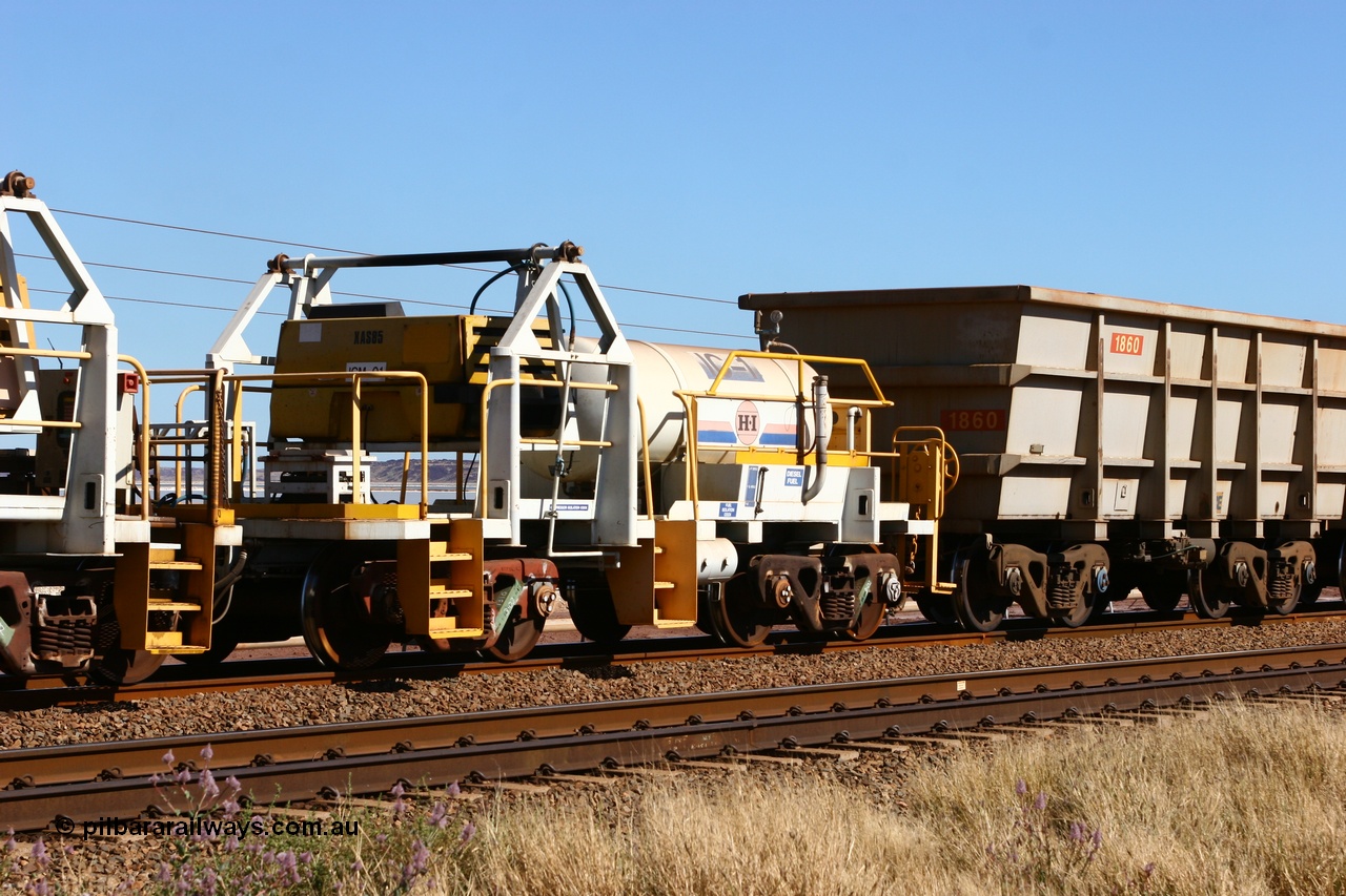 060724 7865
Original Hamersley Iron compressor waggon set IC-1 which were made from cutting down condemned ore waggons and then fitting Atlas Copco XAS 97 air compressors, receiver tanks and fuel tanks. The compressors have been fitted to a swing cradle to limit the in-train forces during the unloading process. 7 Mile 24th July 2006.
Keywords: IC-1;rio-compressor-waggon;
