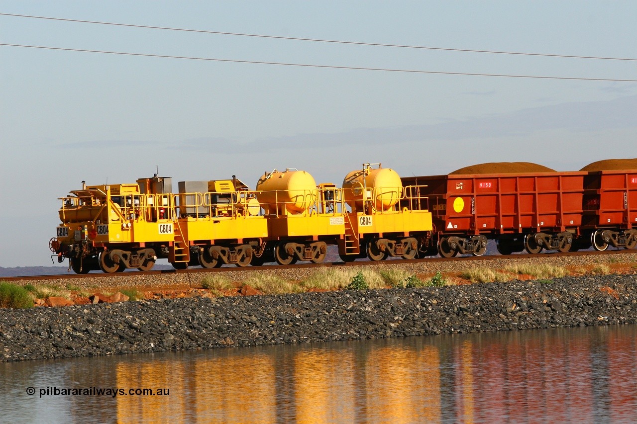 110602 8604
Rio Tinto compressor waggon set CB 04, compressor control waggon with two diesel powered Atlas Copco XAS 97's and the receiver waggon with two air tanks or receivers. Note the waggons are cut down ore waggons. Seen here on the causeway just outside of 7 Mile. 2nd June 2011.
Keywords: CB04;rio-compressor-waggon;