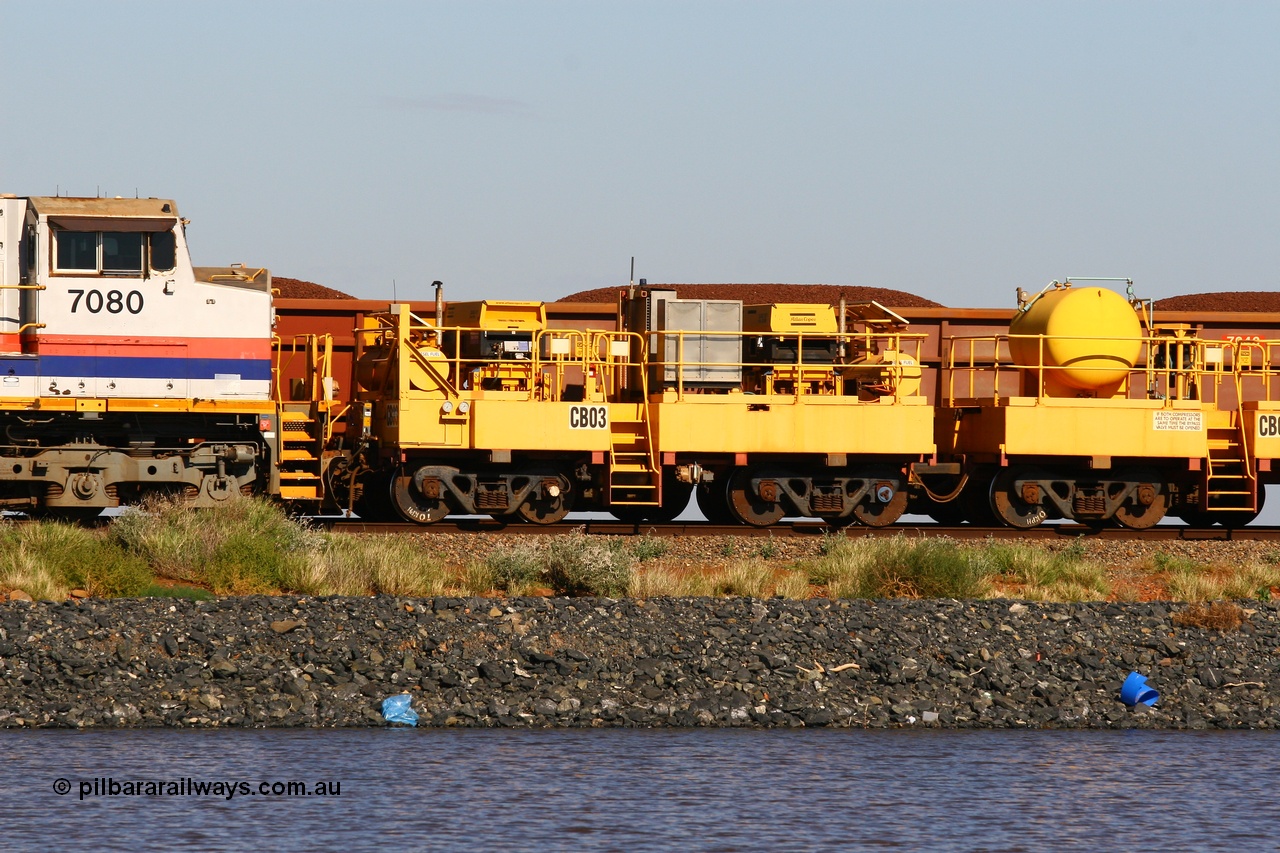110602 8646
Rio Tinto compressor waggon set CB 03, compressor control waggon with two diesel powered Atlas Copco XAS 97's behind the loco. Note these waggons are cut down ore waggons. Seen here on the causeway just outside of 7 Mile. 2nd June 2011.
Keywords: CB03;rio-compressor-waggon;