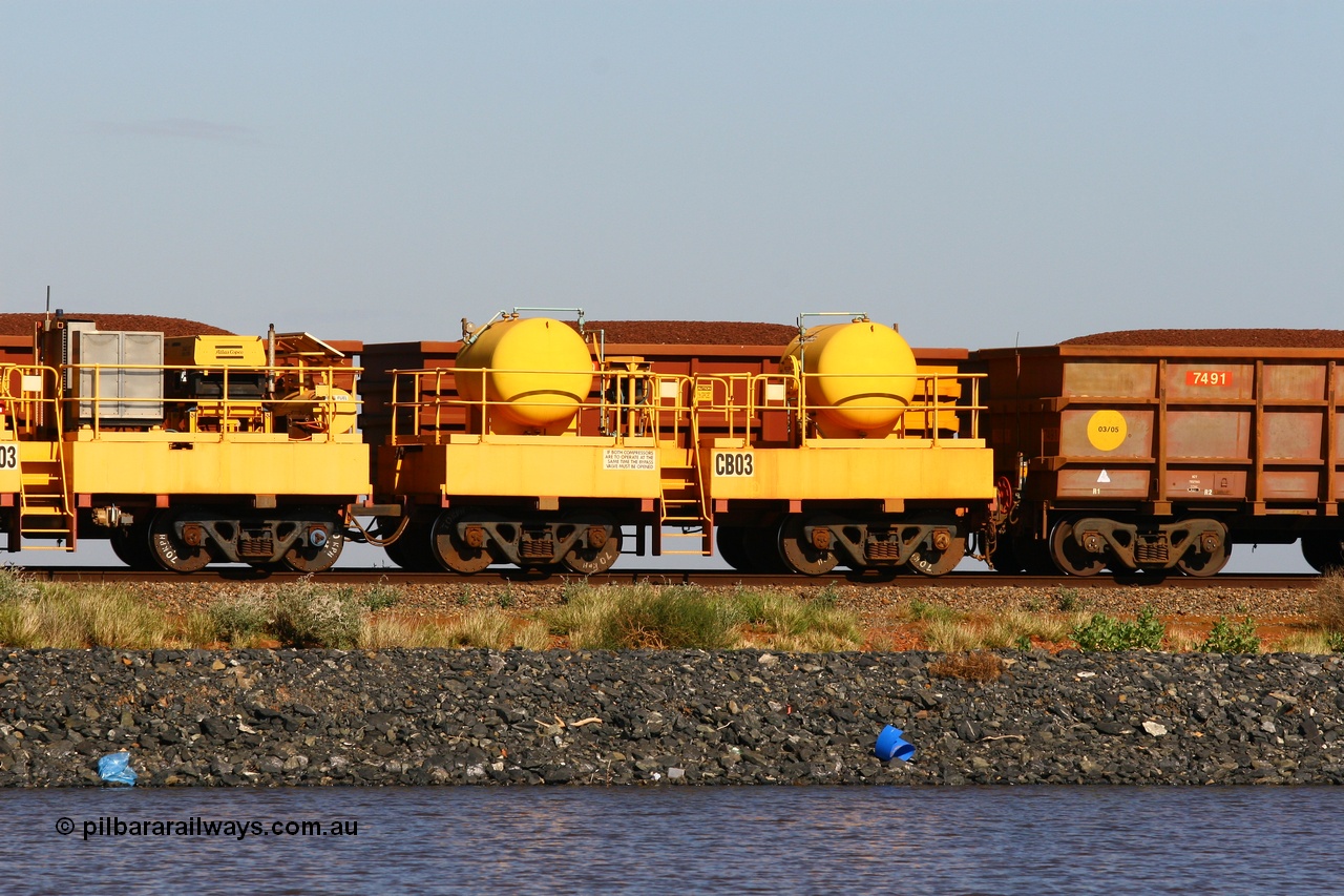 110602 8647
Rio Tinto compressor waggon set CB 03, receiver waggon with two air tanks or receivers. These are built on former ore waggons that have been cut down. Seen here on the causeway just outside of 7 Mile. 2nd June 2011.
Keywords: CB03;rio-compressor-waggon;