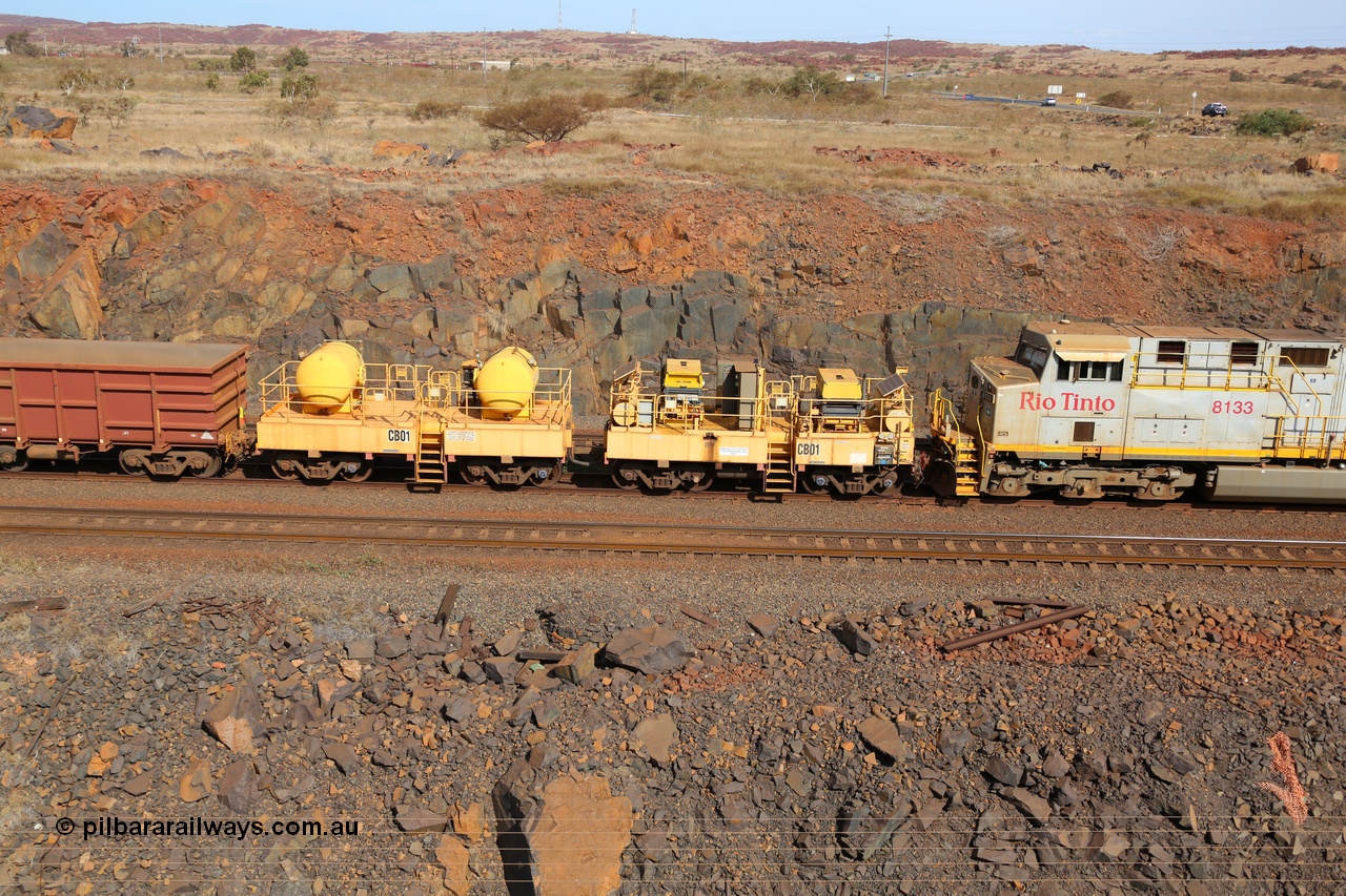 141124 7078
Rio Tinto compressor waggon set leader CB 01, compressor control waggon with two diesel powered Atlas Copco XAS 97's behind the loco and the receiver waggon with two air tanks or receivers. Note the waggons are cut down ore waggons. Seen here at Parker Point, Dampier on 24th November 2014.
Keywords: CB01;rio-compressor-waggon;