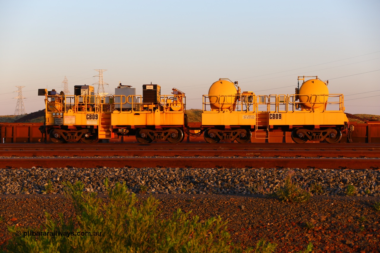 170510 8282
Rio Tinto compressor waggon set CB 09, compressor control waggon with two diesel powered Kaeser M57 Utility air compressors and the receiver waggon with two air tanks or receivers. Note the waggons are modified ore waggon frames. Seen here at Cape Lambert. 10th May 2017.
Keywords: CB09;rio-compressor-waggon;