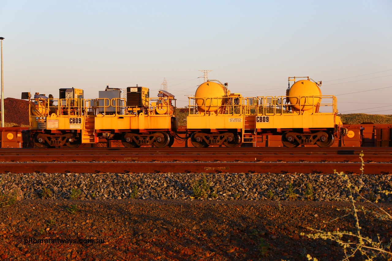 170510 8294
Rio Tinto compressor waggon set CB 09, compressor control waggon with two diesel powered Kaeser M57 Utility air compressors and the receiver waggon with two air tanks or receivers. Note the waggons are modified ore waggon frames. Seen here at Cape Lambert. 10th May 2017.
Keywords: CB09;rio-compressor-waggon;