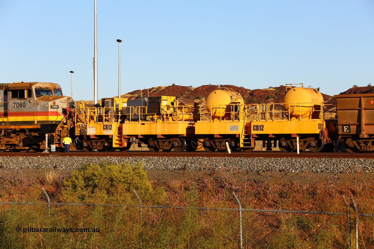 170728 09678
Rio Tinto compressor waggon set CB 12, compressor control waggon with two diesel powered Kaeser M57 Utility air compressors and the receiver waggon with two air tanks or receivers. Note the waggons are modified ore waggon frames. Seen here at Cape Lambert. 28th July 2017.
Keywords: CB12;rio-compressor-waggon;