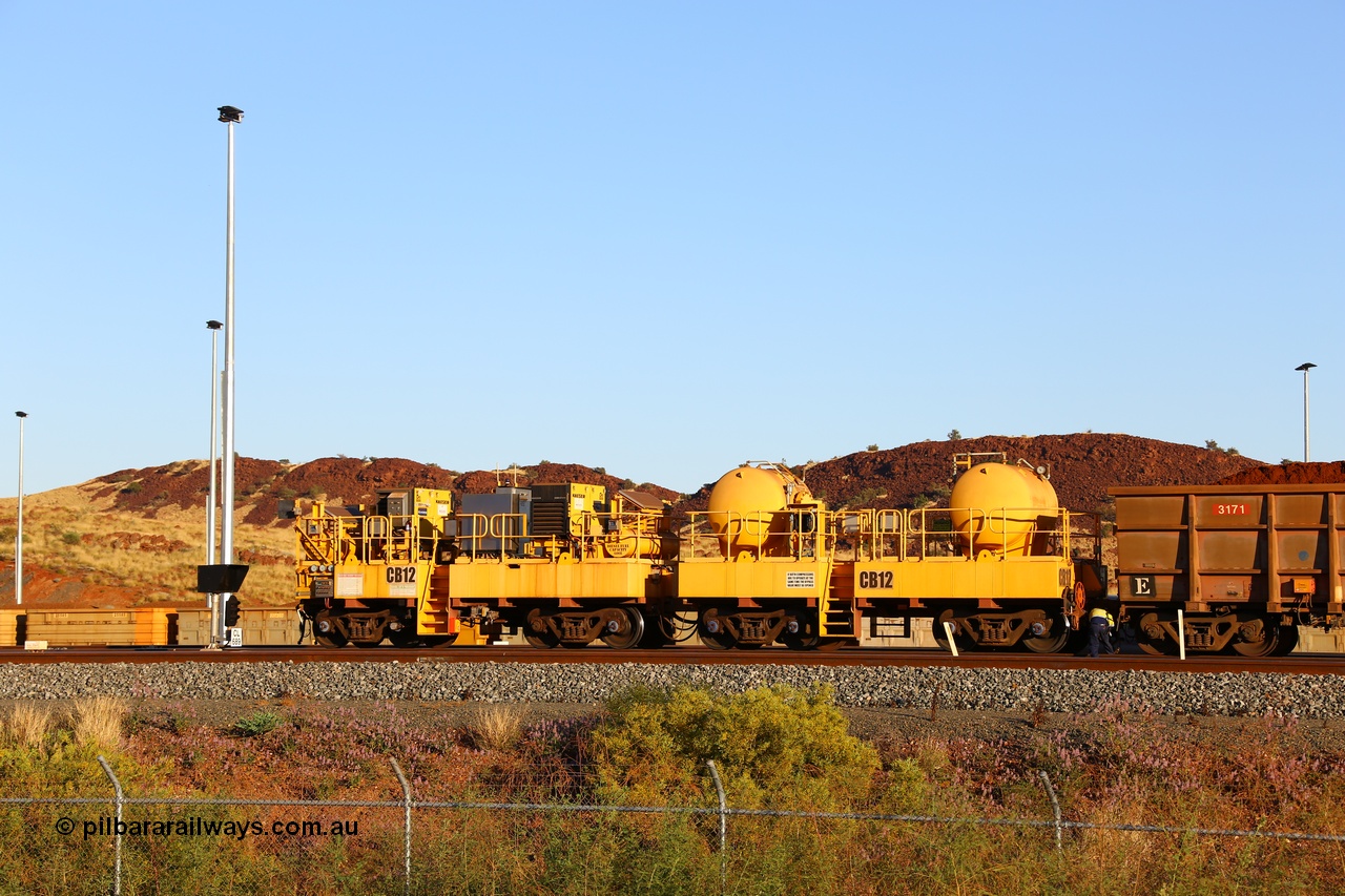 170728 09687
Rio Tinto compressor waggon set CB 12, compressor control waggon with two diesel powered Kaeser M57 Utility air compressors and the receiver waggon with two air tanks or receivers. Note the waggons are modified ore waggon frames. Seen here at Cape Lambert. 28th July 2017.
Keywords: CB12;rio-compressor-waggon;