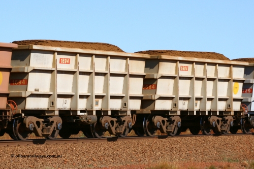 1694-6684 050828 5083
Tunkawanna, loaded Robe River Bradken built S series waggon pair 1694 control and 6684 slave built in January 2002. August 28, 2005.
Keywords: 1694;6684;S-series;Bradken-Rail-Qld;Rio-ore-waggon;