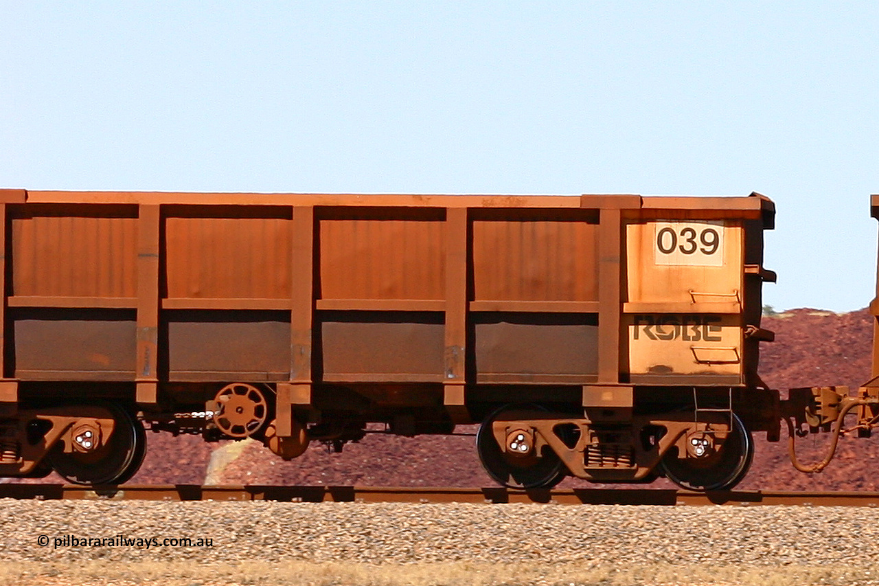 0039 060722 7436
Robe River ore waggon 039, built by Nippon Sharyo Nihon, rotary coupler end handbrake side empty, partial, view at the 45.4 km just south of Harding Siding on the Cape Lambert line. July 22, 2006.
Keywords: 039;Nippon-Sharyo-Nihon;Robe-ore-waggon;