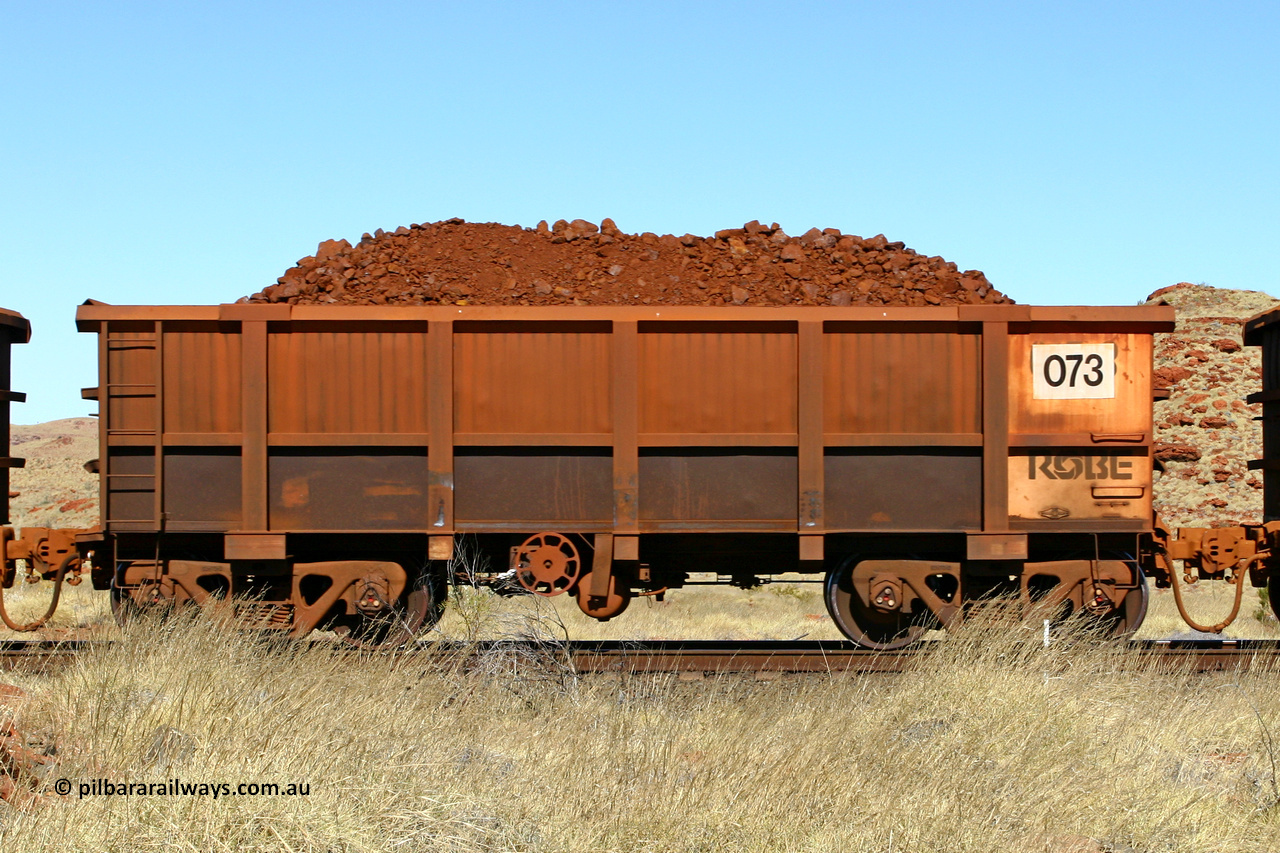 0073 060722 7504
Robe River ore waggon 073, built by Nippon Sharyo Nihon, handbrake side loaded view at the 78.8 km between Western Creek and Maitland on the Deepdale line. July 22, 2006.
Keywords: 073;Nippon-Sharyo-Nihon;Robe-ore-waggon;