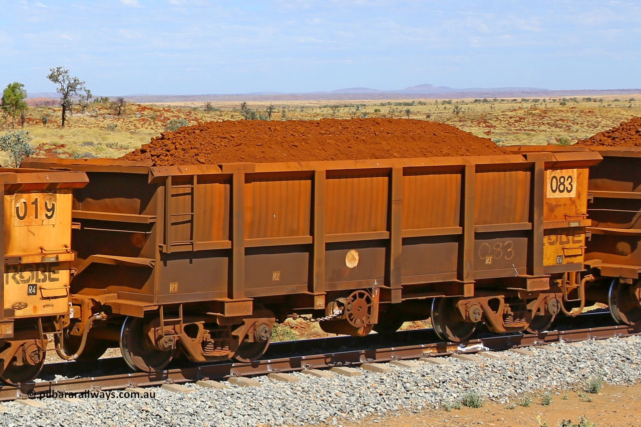 0083 170729 0268
Robe River ore waggon 083, built by Nippon Sharyo Nihon, fixed coupler handbrake side loaded view shows Centurion Industries style end with drop rib, at the 103 km, between Maitland Siding and the Fortescue River on the Deepdale line. July 29, 2017.
Keywords: 083;Nippon-Sharyo-Nihon;Robe-ore-waggon;